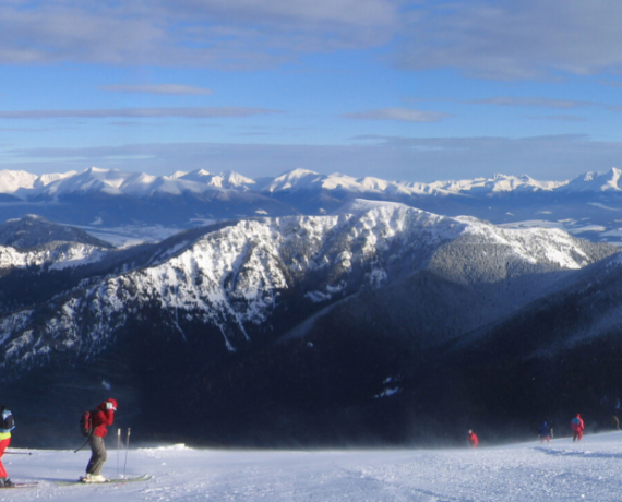 jasna ski area and skiers in foreground